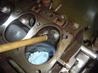  lapping in the new exhaust valves into the seats in the block